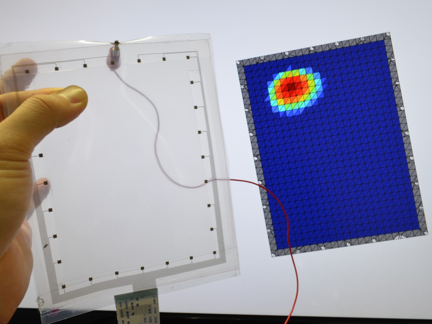 Transparent tactile sensor using tomography